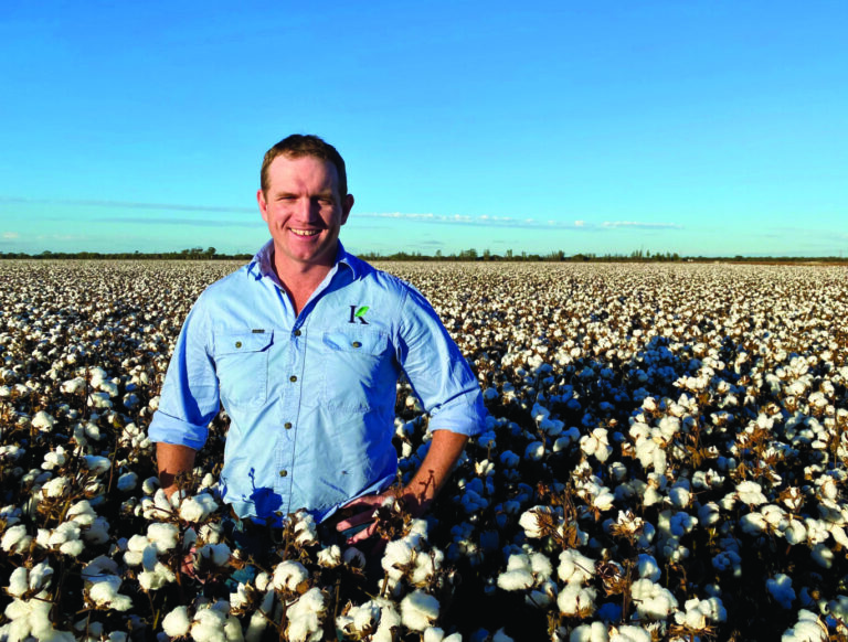 James Kanaley standing in a cotton crop smiling