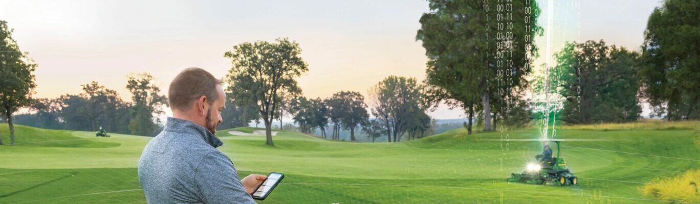 Image of a gator, using OnLink from John Deere on a golf course